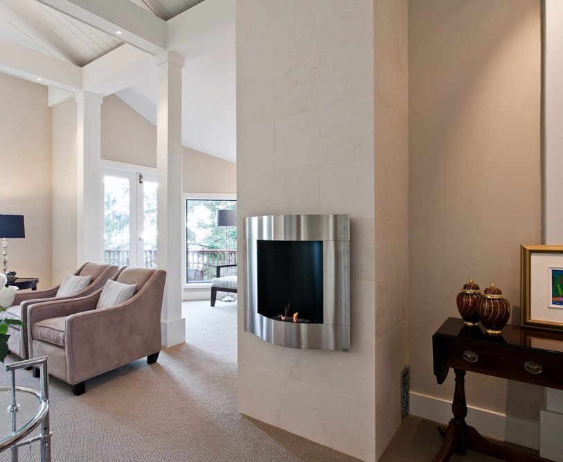 Spacious living room with a modern fireplace and large windows. - 3880 Sharon Drive, West Vancouver