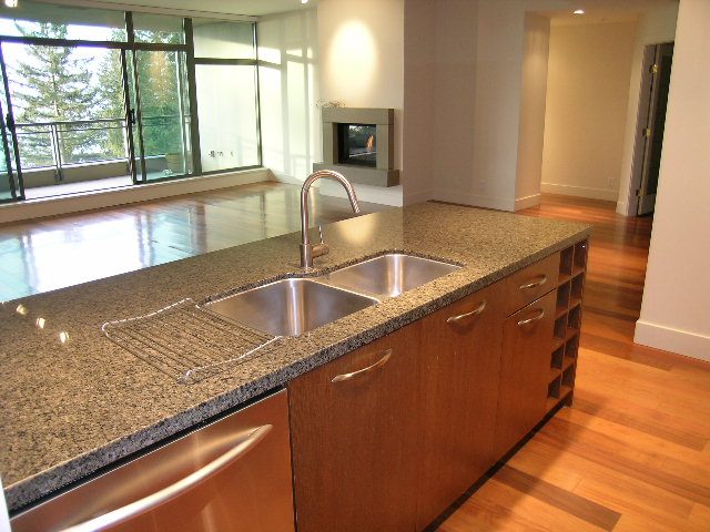 Bright kitchen with granite countertops, hardwood floors, and a city view. - 602 - 3355 Cypress Place, West Vancouver