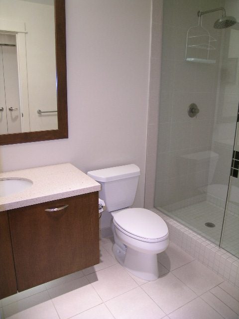Bright bathroom with granite countertops and a walk-in shower. - 602 - 3355 Cypress Place, West Vancouver