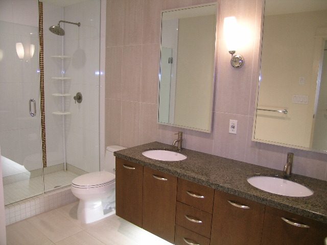 Bright bathroom with granite countertops and a walk-in shower. - 602 - 3355 Cypress Place, West Vancouver