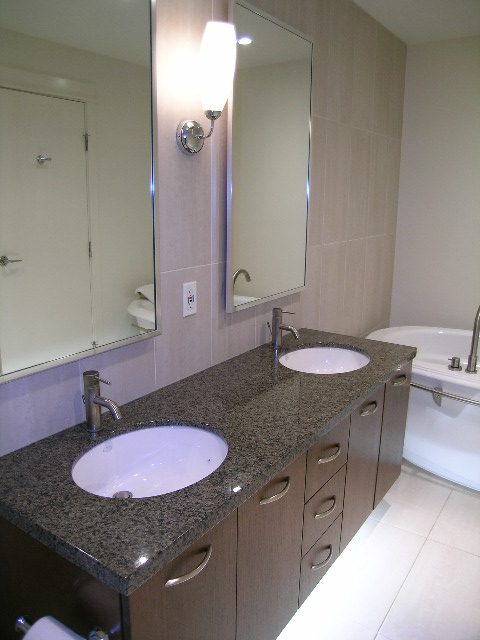 Bathroom with granite countertops and modern fixtures. - 602 - 3355 Cypress Place, West Vancouver