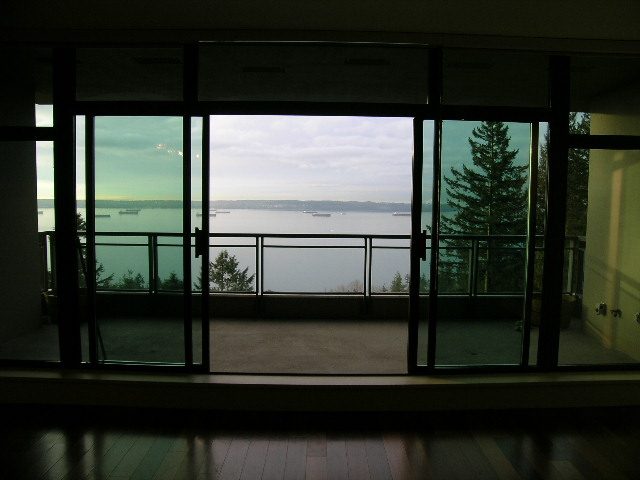 Bright living room with city view and hardwood floors. - 602 - 3355 Cypress Place, West Vancouver