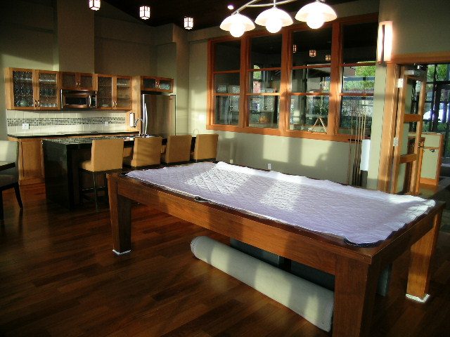 Furnished kitchen with hardwood floors, city view, and modern appliances. - 602 - 3355 Cypress Place, West Vancouver