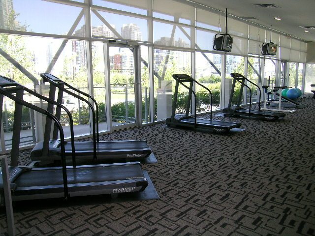 Fitness room with treadmills and city view. - 508 - 1408 Strathmore Mews, Vancouver Downtown
