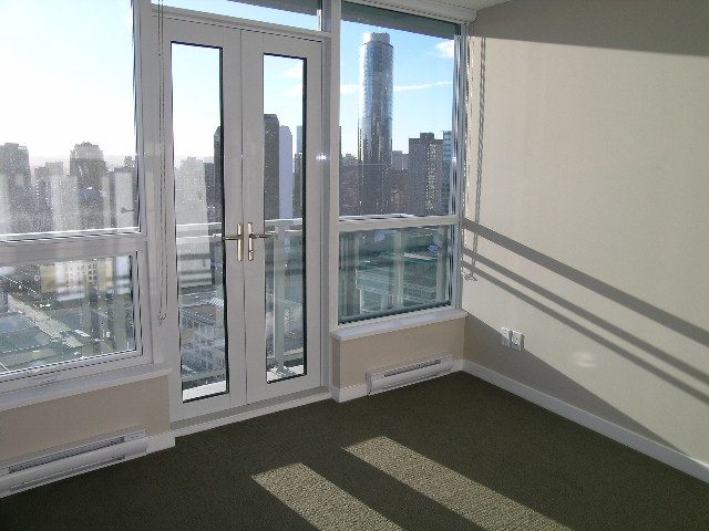 Spacious 1-bedroom condo with large windows offering a stunning city view, featuring a modern balcony and ample natural...