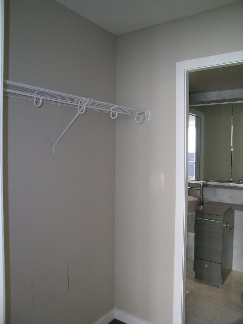 Spacious bathroom with modern vanity and large mirror. - 2307 - 833 Seymour Street, Vancouver Downtown