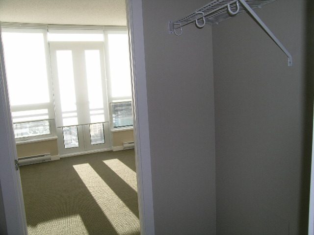 Spacious 1-bedroom condo with a bright balcony view and modern closet shelving. - 2307 - 833 Seymour Street, Vancouver Downtown