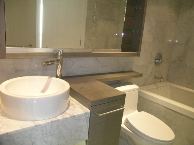 Modern bathroom with marble countertops and a sleek sink. - 2307 - 833 Seymour Street, Vancouver Downtown