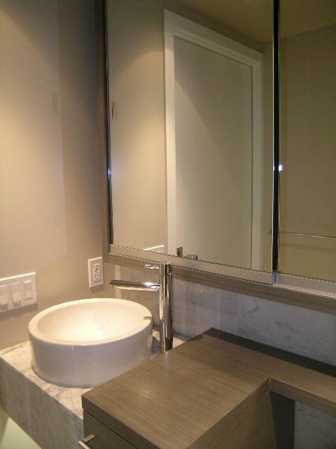 Modern bathroom with sleek white sink and marble countertop. - 2307 - 833 Seymour Street, Vancouver Downtown