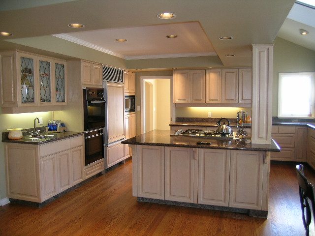 Bright kitchen with light wood cabinets, granite countertops, and hardwood floors. - 1875 26th Street, West Vancouver