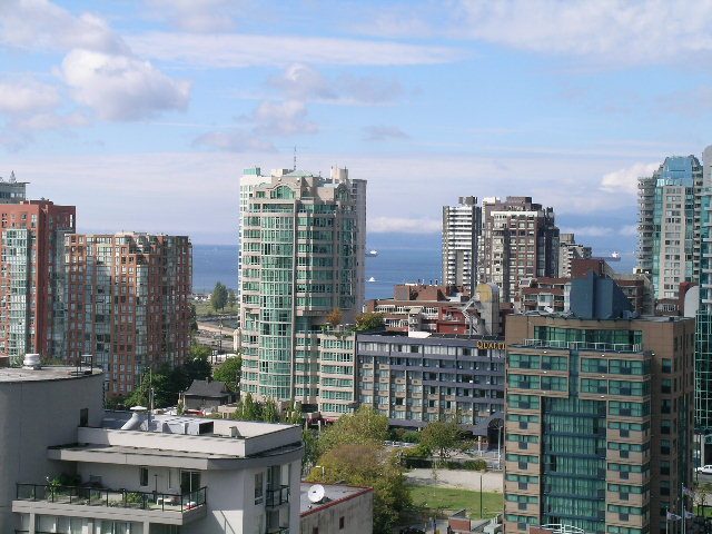 Spacious 2-bedroom condo with stunning city view, featuring modern furnishings and a cozy living space.
