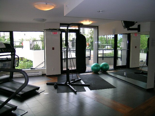 Spacious fitness room with large windows, hardwood flooring, and a treadmill. - 2109 - 1295 Richards Street, Vancouver Downtown