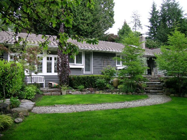 Spacious 4-bedroom house with a lush garden and stone pathway leading to the front door. - 2795 Palmerston Avenue, West Vancouver