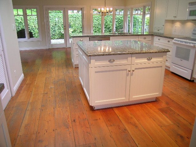 Bright kitchen with granite countertops, white cabinetry, and hardwood floors. - 2795 Palmerston Avenue, West Vancouver