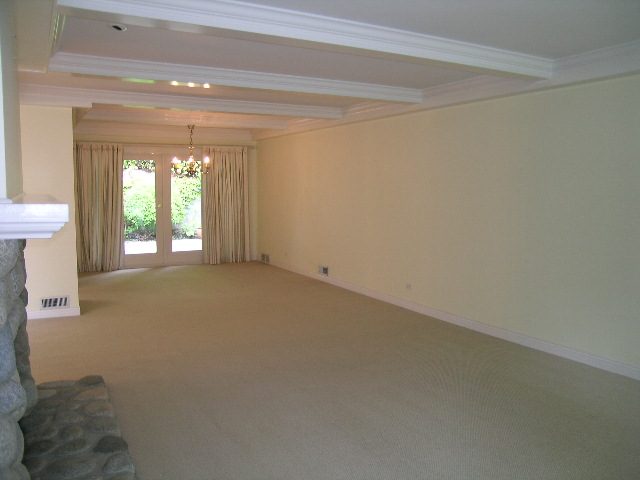 Spacious living room with beige carpet, coffered ceiling, and large windows. - 2795 Palmerston Avenue, West Vancouver