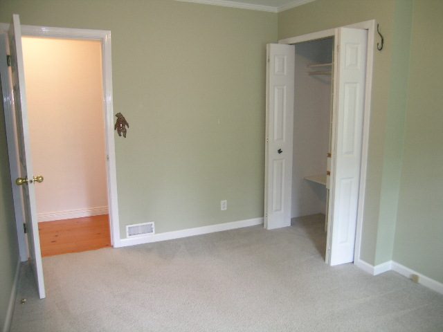 Spacious living room with carpeted floor and closet access. - 2795 Palmerston Avenue, West Vancouver