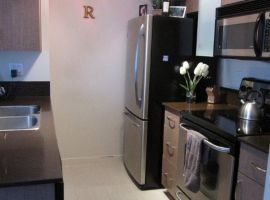 Bright kitchen with stainless steel appliances and granite countertops. - 302-977 Mainland Street, Vancouver Downtown