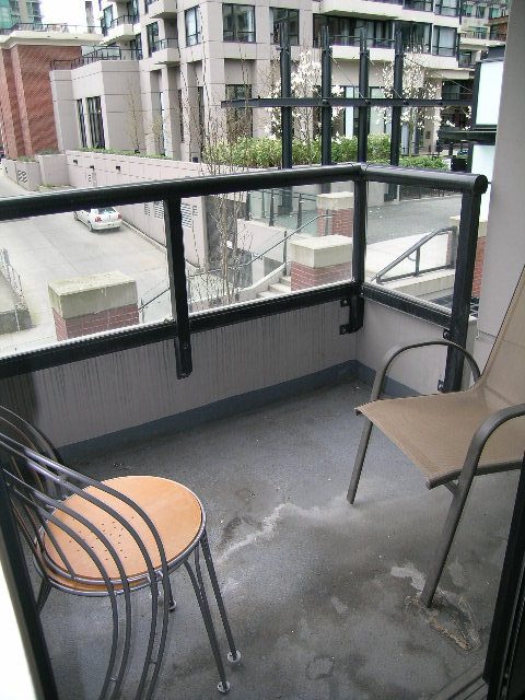 Furnished balcony with metal railings, city view, and outdoor seating. - 302-977 Mainland Street, Vancouver Downtown