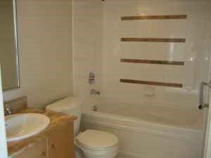 Furnished bathroom with modern sink and bathtub, light wood accents. - 302-977 Mainland Street, Vancouver Downtown