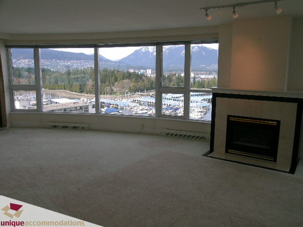 Spacious living room with panoramic city view and modern fireplace. - 1903 - 535 Nicola Street, Vancouver Downtown