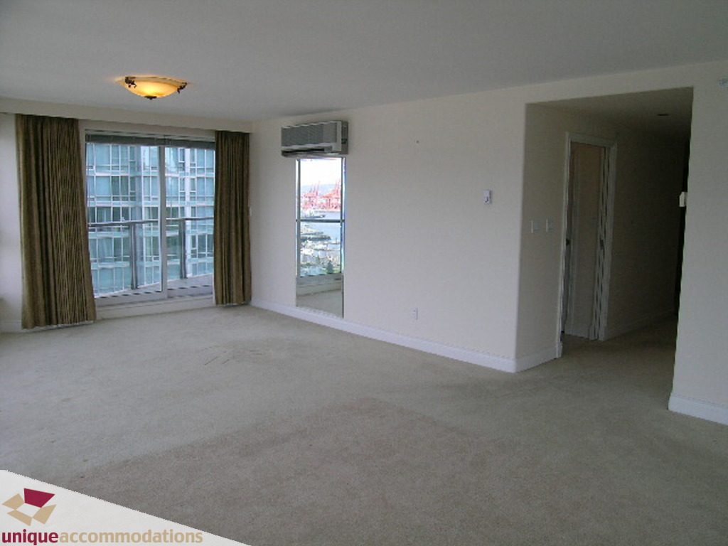Spacious living room with city view and carpeted floor. - 1903 - 535 Nicola Street, Vancouver Downtown