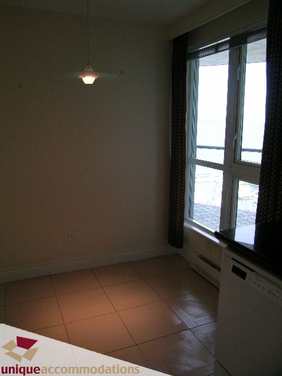 Spacious living room with large window, tiled floor, and modern pendant light. - 1903 - 535 Nicola Street, Vancouver Downtown