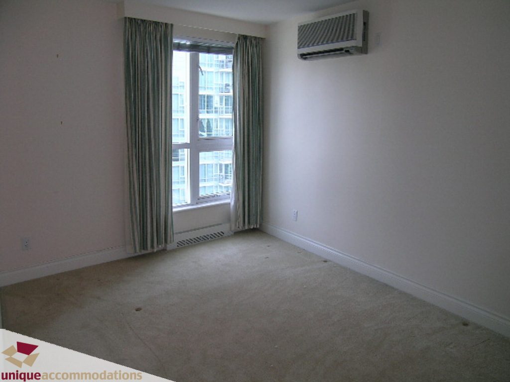 Spacious living room with large windows and city view, perfect for relaxation. - 1903 - 535 Nicola Street, Vancouver Downtown