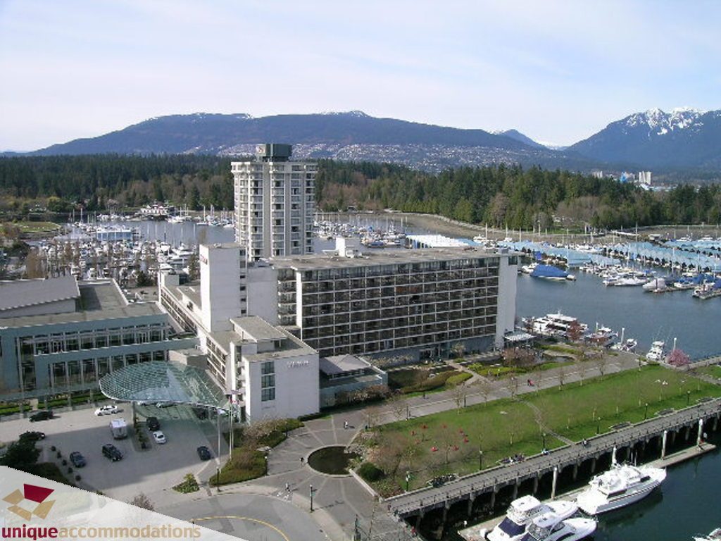 Spacious 3-bedroom condo with stunning city and mountain views, modern furnishings, and waterfront access.