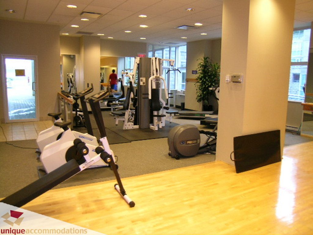 Spacious fitness room with hardwood floors and large windows, perfect for workouts. - 1903 - 535 Nicola Street, Vancouver Downtown
