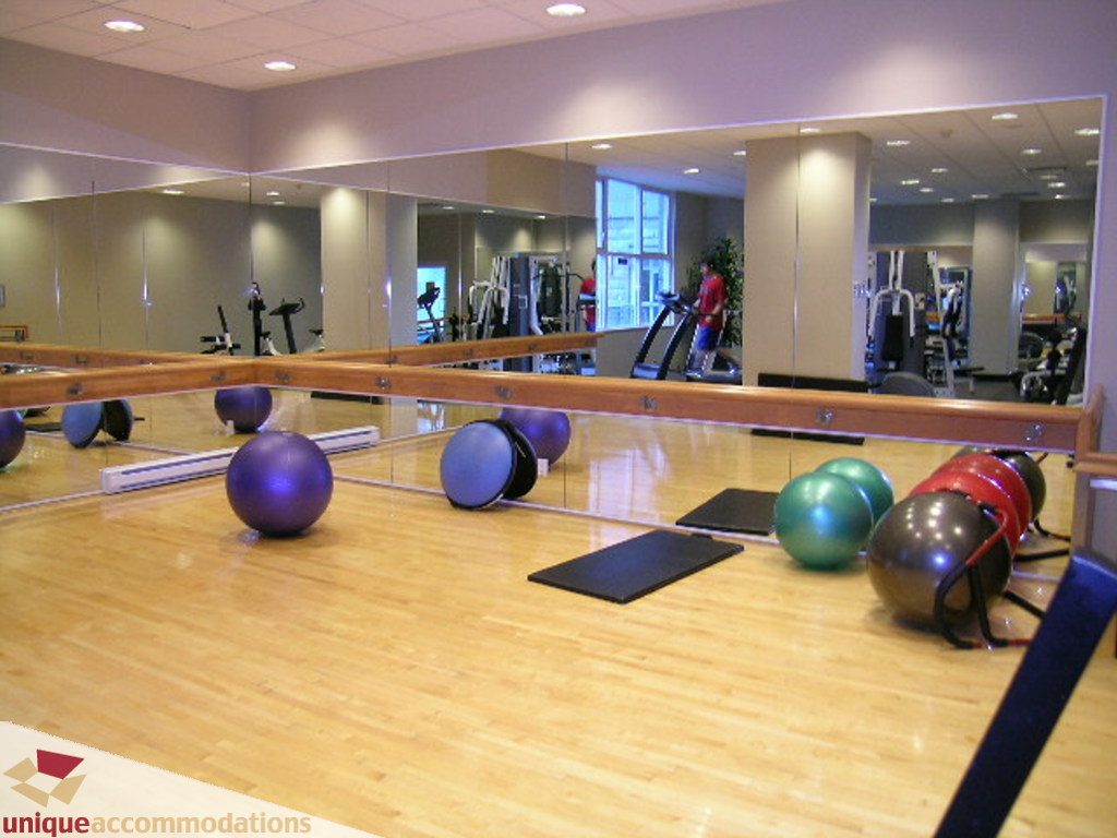 Spacious fitness studio with hardwood floors, exercise balls, and mirrors. - 1903 - 535 Nicola Street, Vancouver Downtown