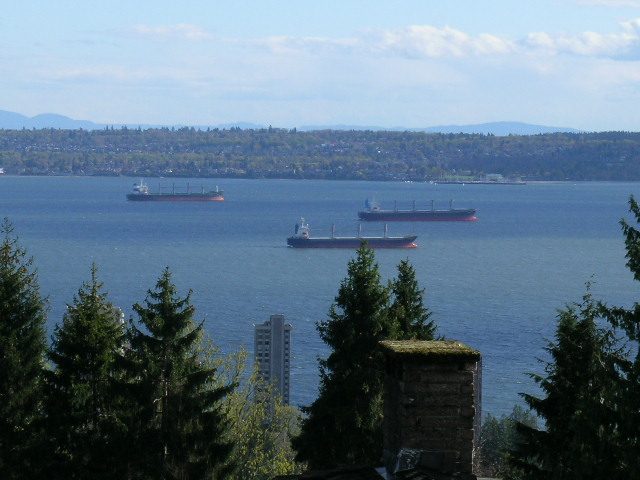 Spacious living room with a stunning city view and waterfront access. - 1965 22nd Street, West Vancouver