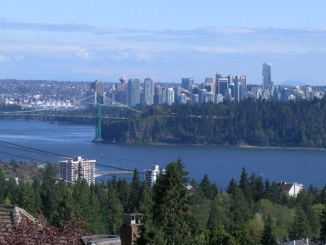 Bright living room with stunning city view and waterfront access. - 1965 22nd Street, West Vancouver