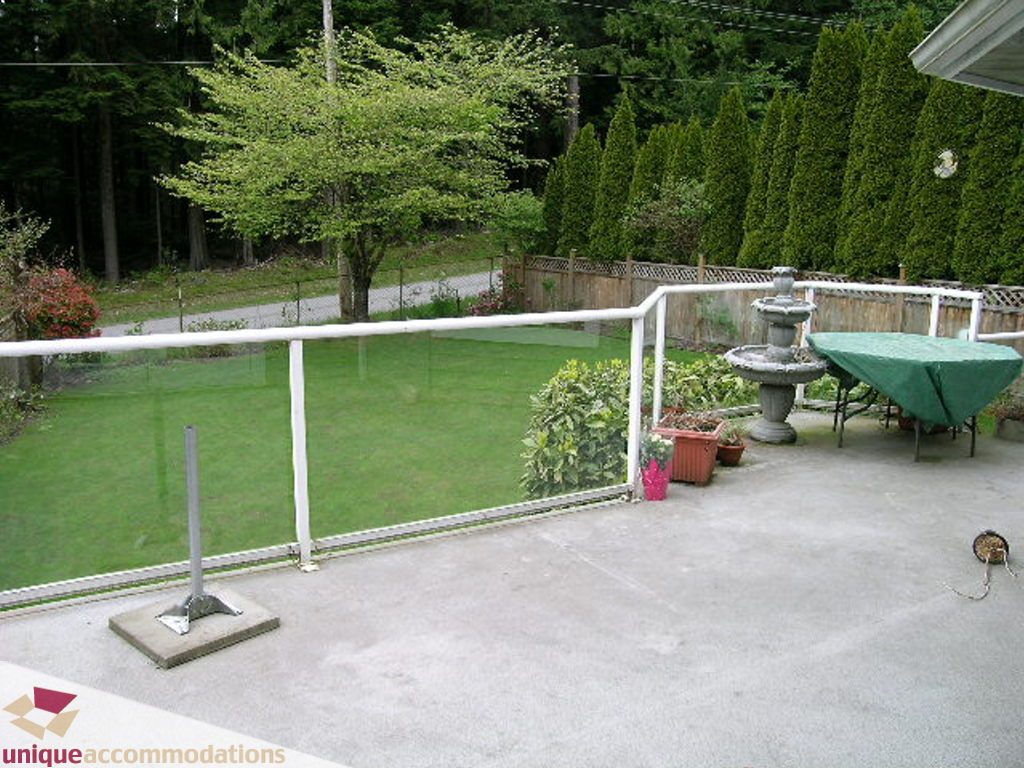 Furnished patio with greenery and outdoor furniture. - 5735 Nancy Green way, North Vancouver