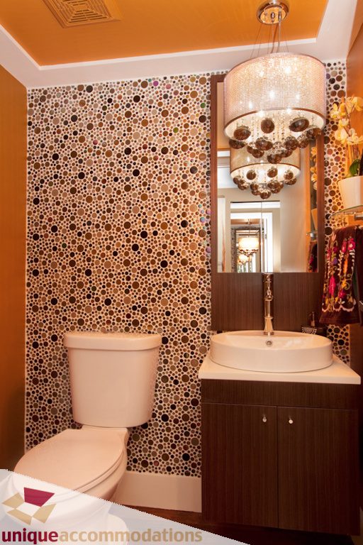 Bathroom with mosaic tile walls, modern vanity, and chandelier. - 1806 - 1500 Howe St, Vancouver Downtown