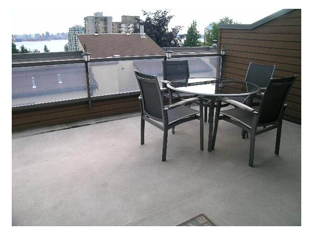 Furnished patio with a round table, chairs, and city view. - 3-220 East 4th Street, North Vancouver