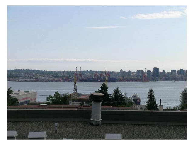 Furnished living room with city view and waterfront access. - 3-220 East 4th Street, North Vancouver