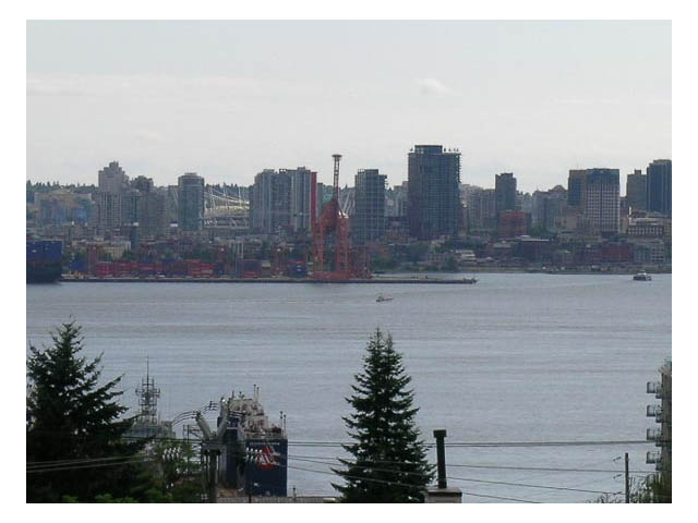 Furnished living room with a stunning city view and waterfront access. - 3-220 East 4th Street, North Vancouver