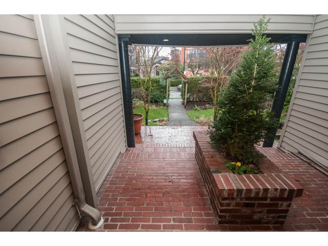 Furnished patio with brick flooring and garden view. - 1882 Whyte Avenue, Vancouver West Side