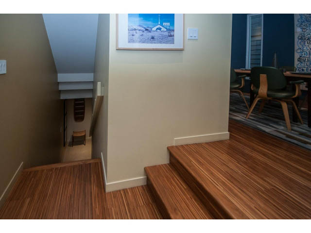 Furnished living room with hardwood floors and a dining area in the background. - 1882 Whyte Avenue, Vancouver West Side