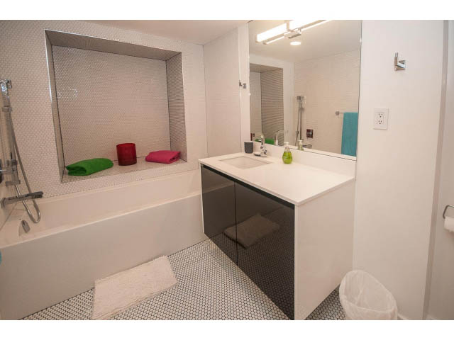 Furnished bathroom with white countertops and patterned floor tiles. - 1882 Whyte Avenue, Vancouver West Side