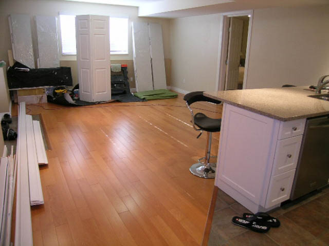 Bright kitchen with hardwood floors and granite countertops, partially furnished. - 1077 Blue Grouse Way, North Vancouver