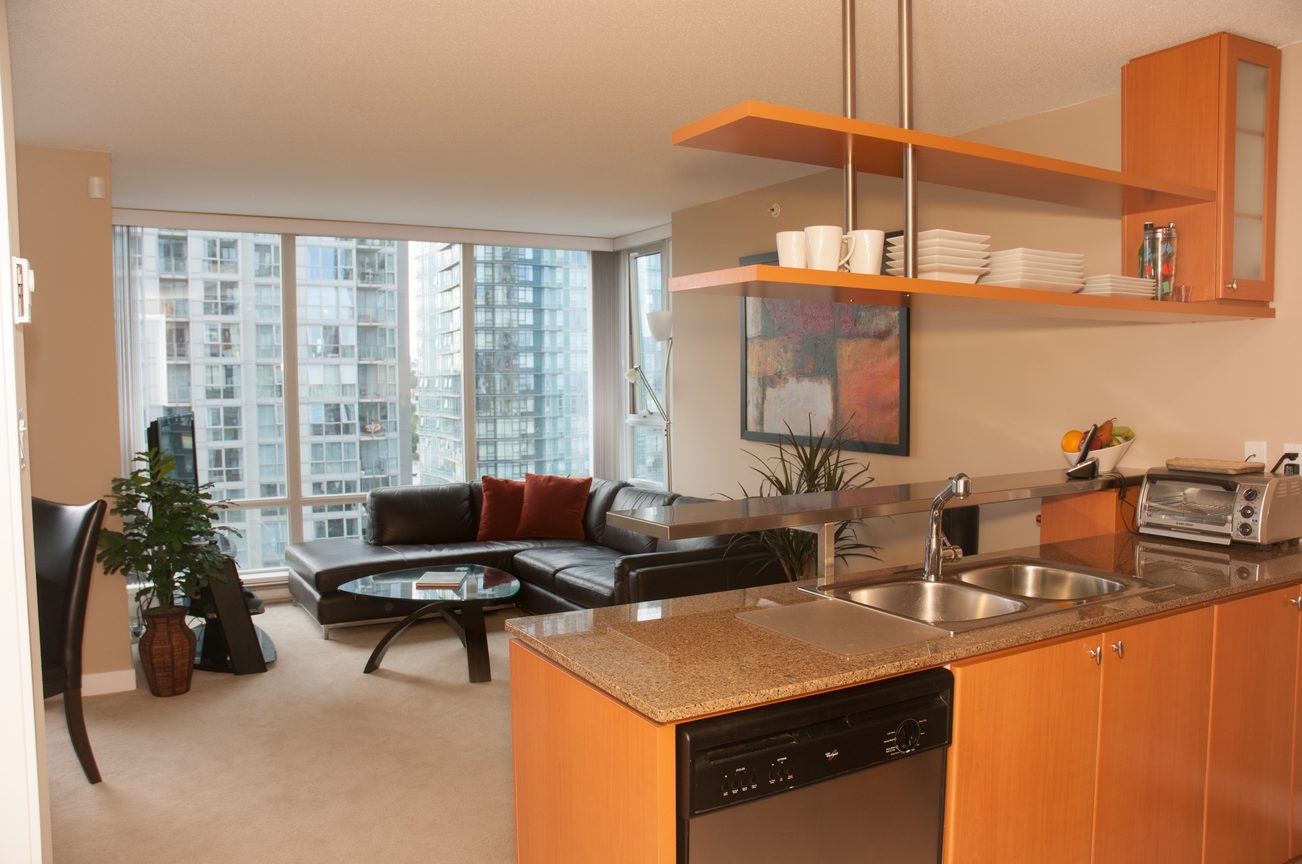 Bright kitchen with granite countertops and city view, modern open-concept design. - 1708 - 1438 Richards Street, Vancouver Downtown