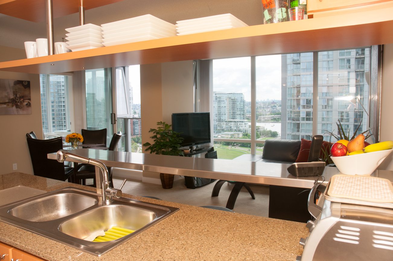 Bright kitchen with granite countertops, stainless steel sink, and city view. - 1708 - 1438 Richards Street, Vancouver Downtown