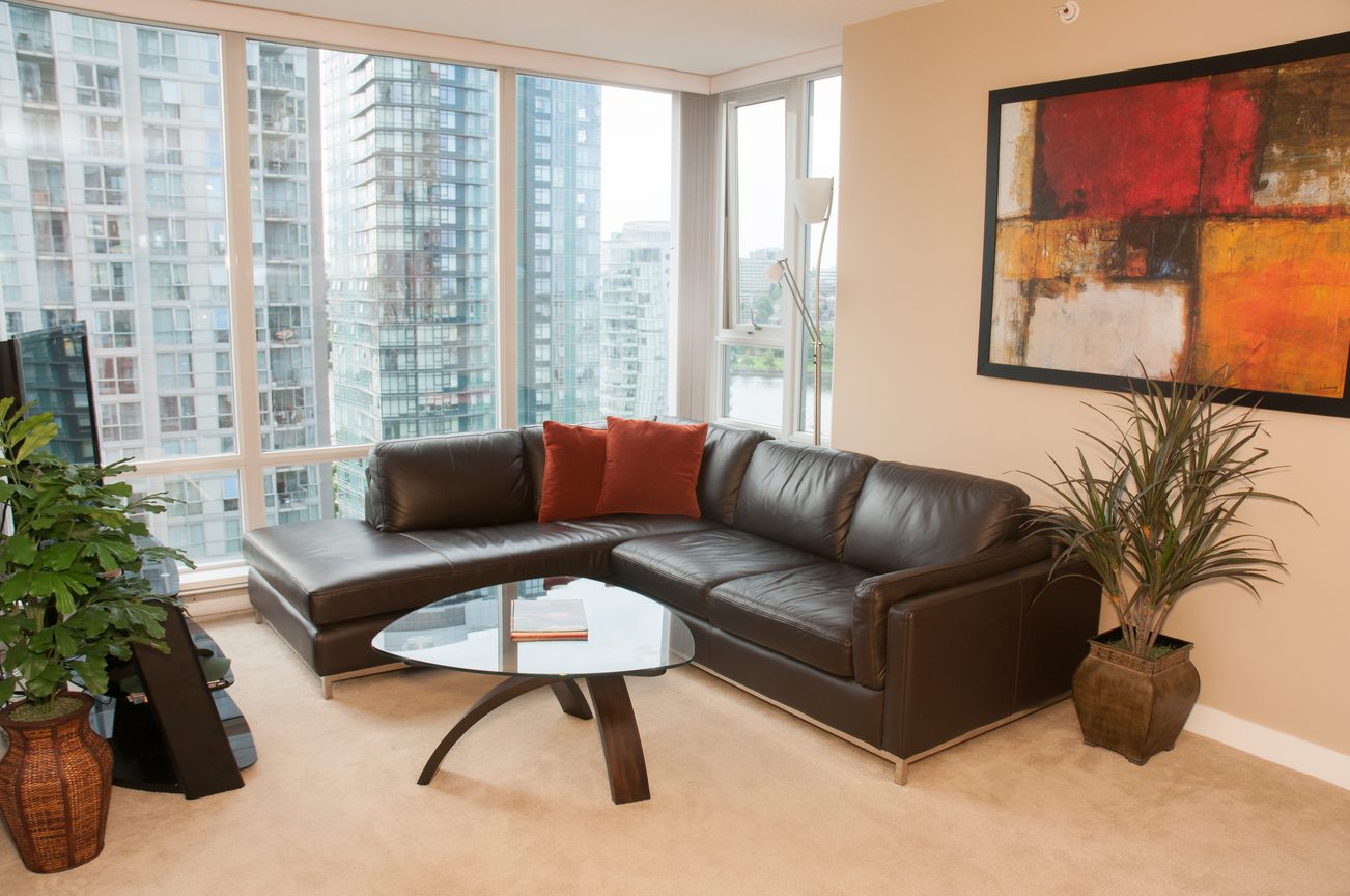 Bright living room with modern furniture, city view, and large windows. - 1708 - 1438 Richards Street, Vancouver Downtown