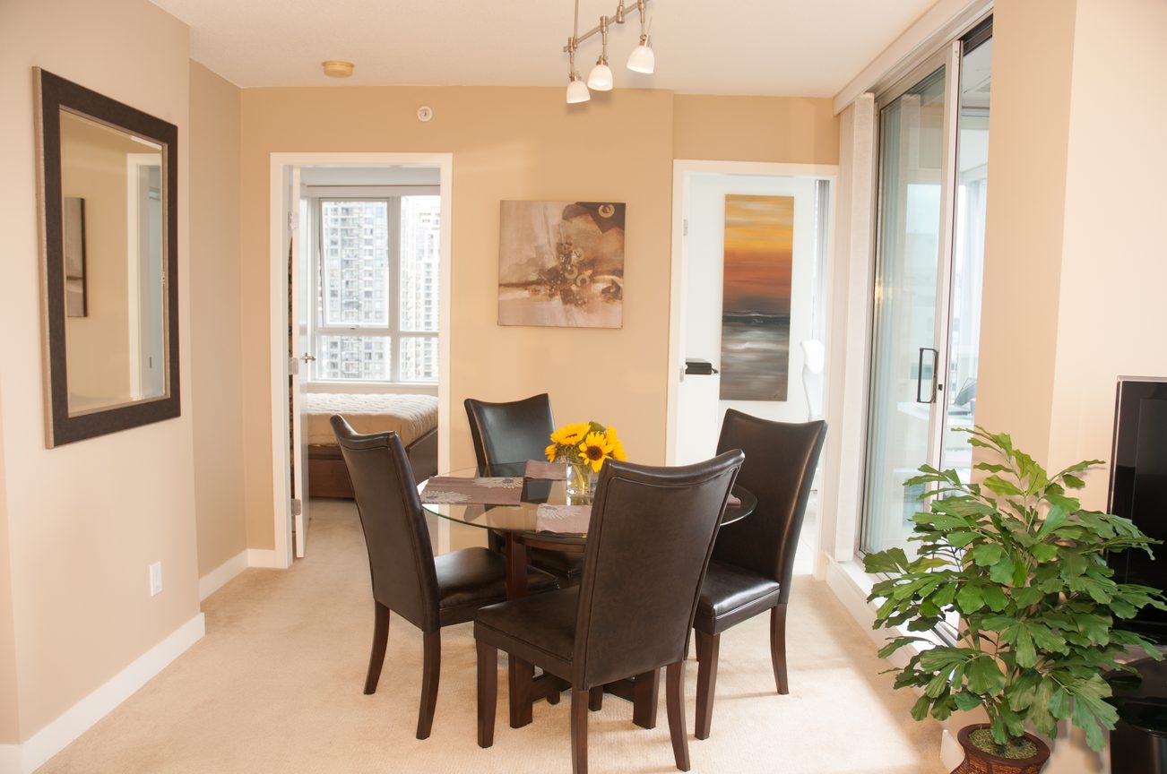 Furnished dining area with city view and modern decor. - 1708 - 1438 Richards Street, Vancouver Downtown