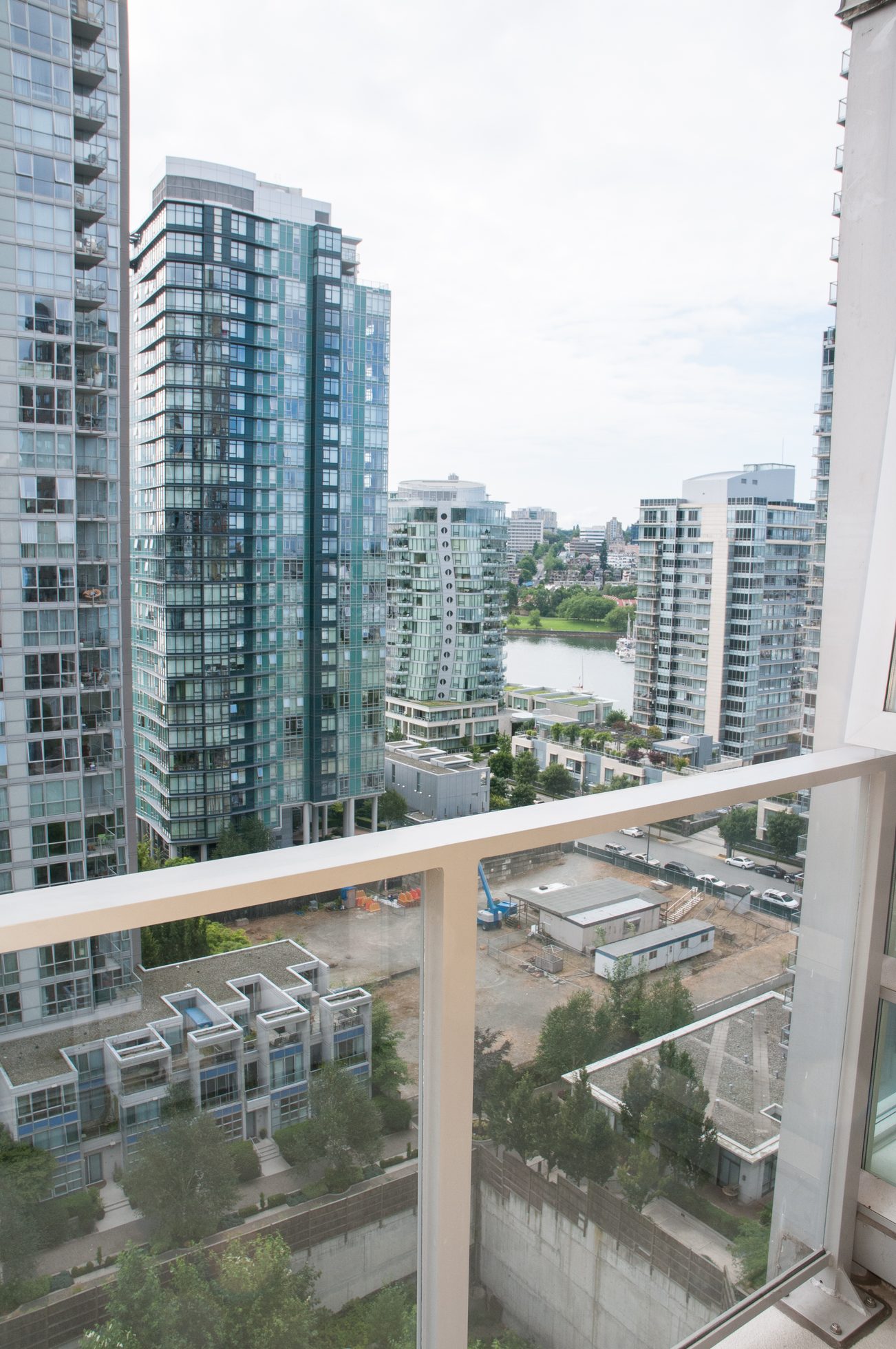 Furnished balcony with city view and modern high-rise buildings. - 1708 - 1438 Richards Street, Vancouver Downtown