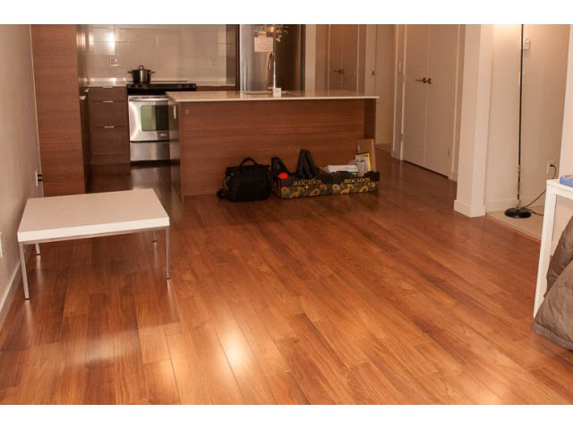 Bright kitchen with wooden countertops and hardwood floors, tidy and ready for move-in. - 215 - 1677 Lloyd Avenue, North Vancouver
