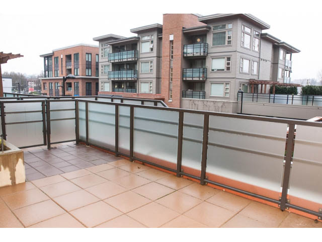 Furnished balcony with tiled flooring and city view. - 215 - 1677 Lloyd Avenue, North Vancouver