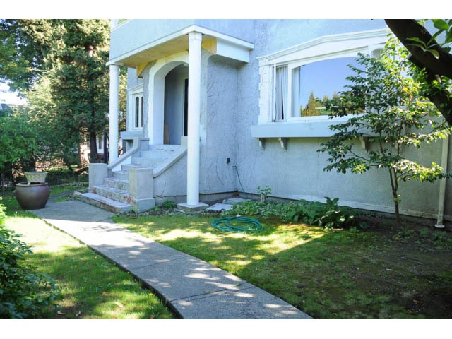 Furnished entryway with steps leading to a front door, surrounded by greenery. - 3998 West 10th Avenue, Vancouver West Side