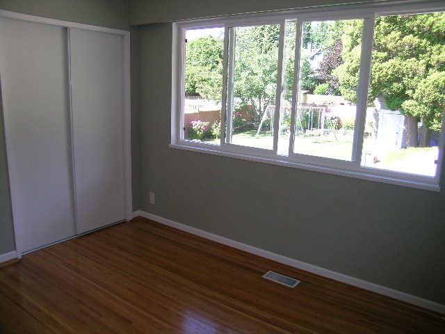 Bright den with hardwood floors and large windows overlooking trees. - #2 (Upper) - 350 23rd St E, North Vancouver